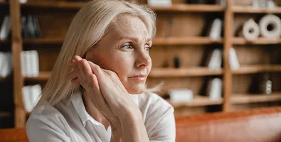 A remote worker on a video call, representing hybrid working challenges