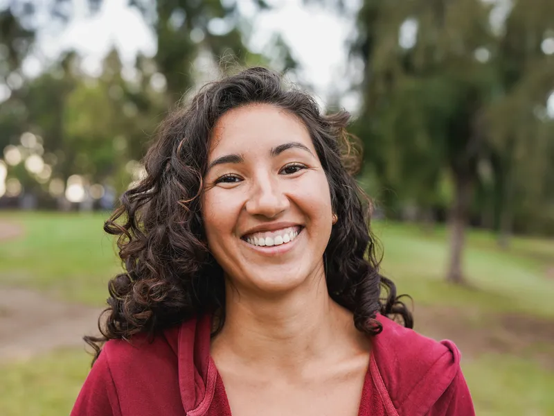 woman smiling outside