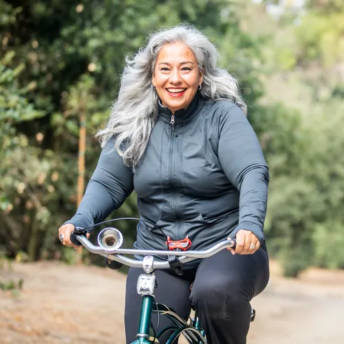 Woman laughing on a bike