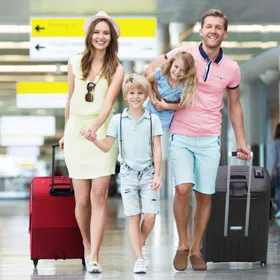 Family in airport going on holiday
